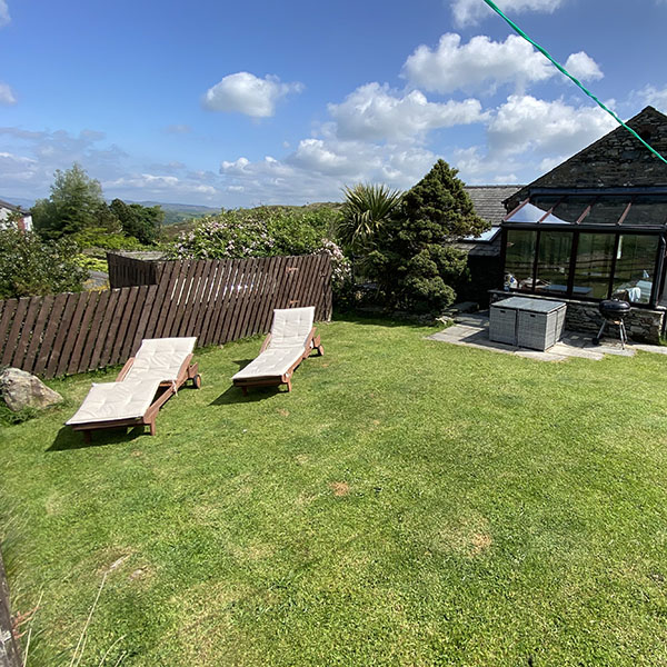 Tyan cottage sunny garden with loungers